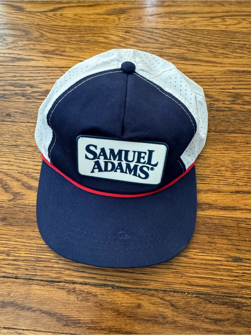 Samuel Adams brewery cap with rope across brim and rubberized front patch